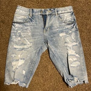 Light blue jeans with white paint